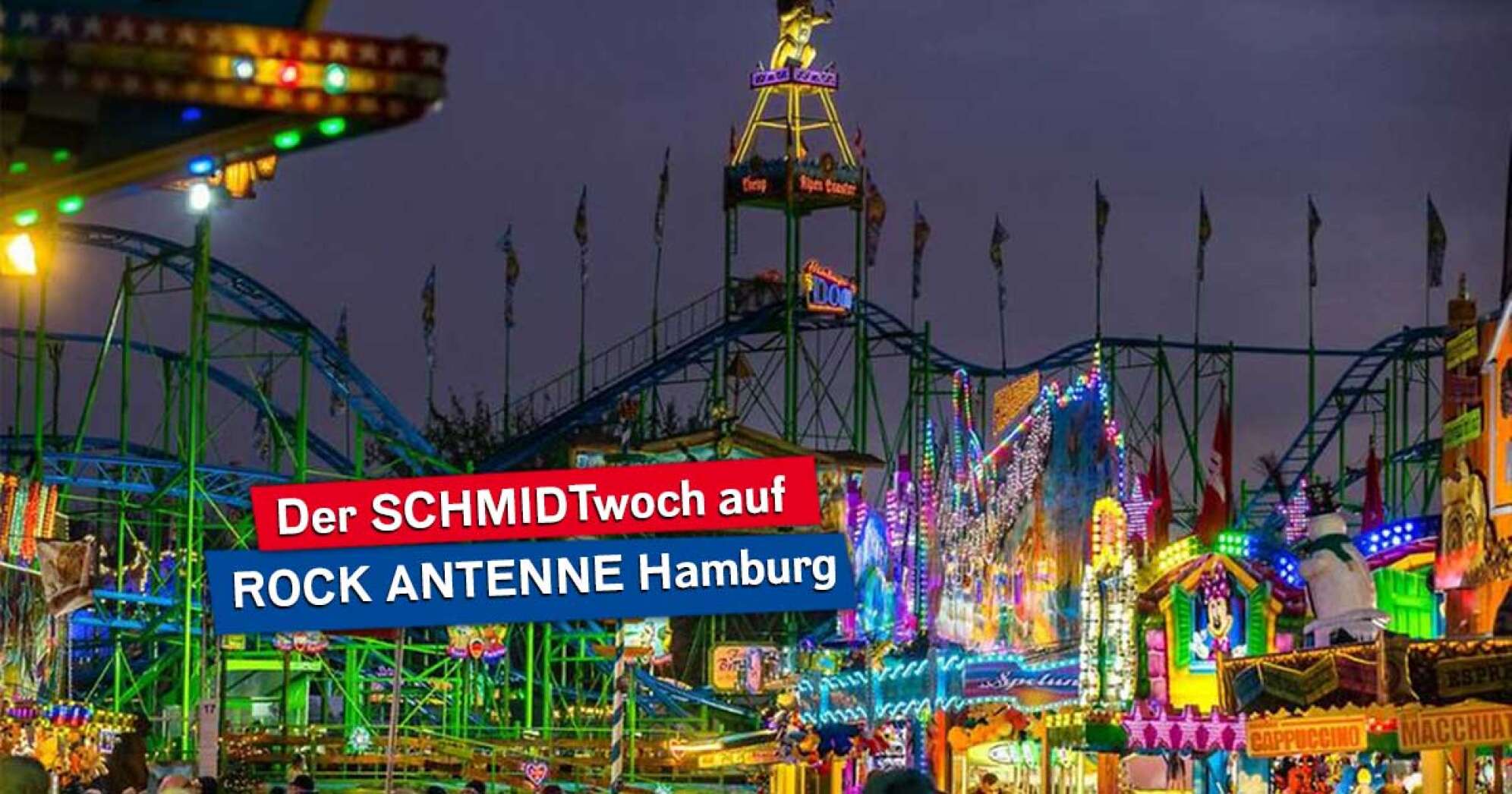 Der Hamburger Dom mit Fahrgeschäften bei Nacht